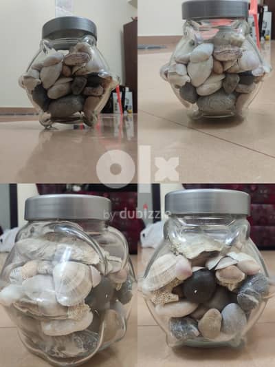 GLASS JAR WITH PEBBLES AND SHELLS