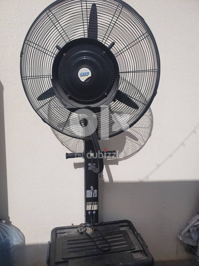 In great condition,  Rarely used out door fan with mist 1