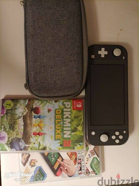 Nintendo switch lite (Black) + 15 games (2 physical 13 digital) + bag 1
