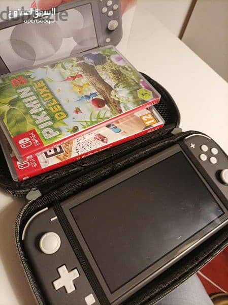 Nintendo switch lite (Black) + 15 games (2 physical 13 digital) + bag 8
