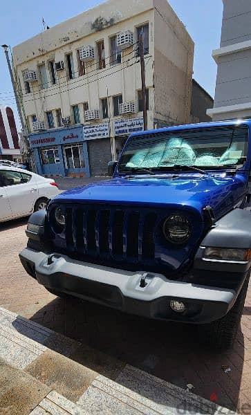 jeep wrangler 4 door blue sport 0