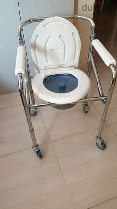 portable commode for patients or individuals with restricted mobility. 0
