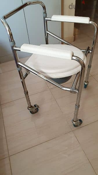 portable commode for patients or individuals with restricted mobility. 1