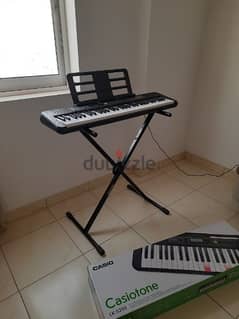 Casio lighting keyboard - LK-S250 with adaptor, pedal and stand