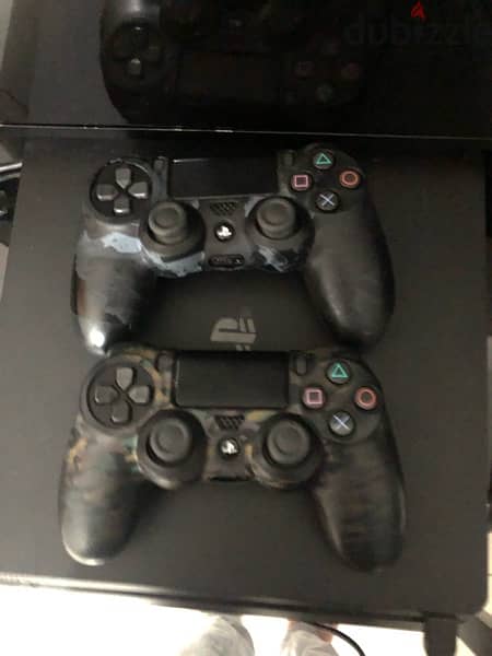 PS4 1TB with Two orignal remotes 1