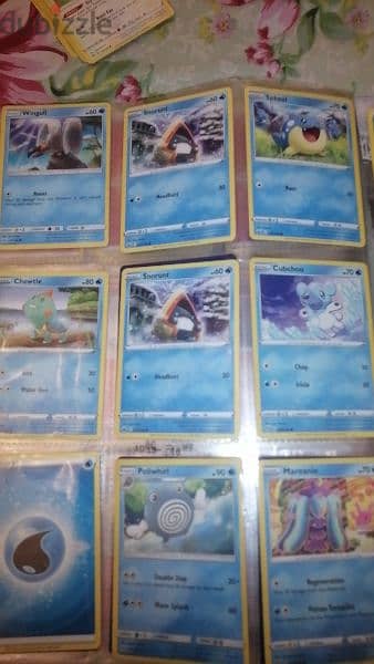Pokémon and fifa cards with mewtwo covers and book 3