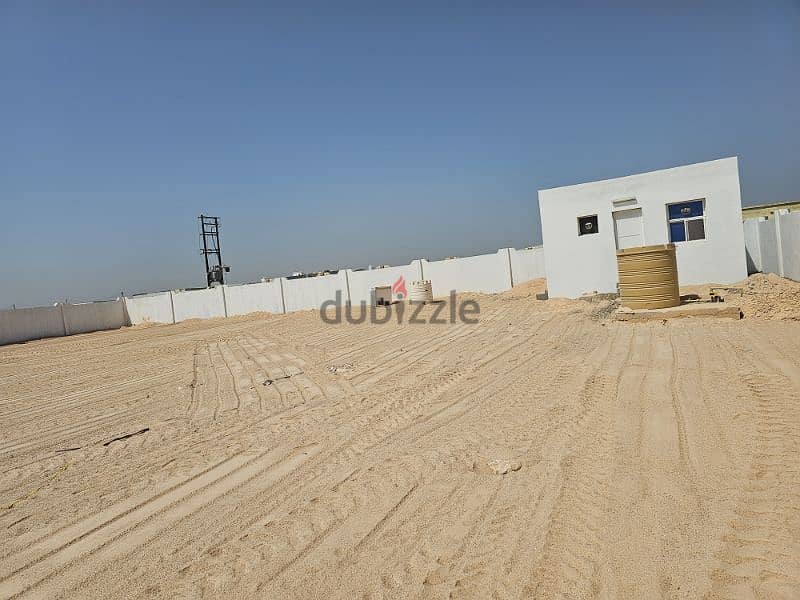 أرض صناعية زاوية للبيع مؤجرة مساحة 1500متر مسورة مجهزة صحار العوهي 2