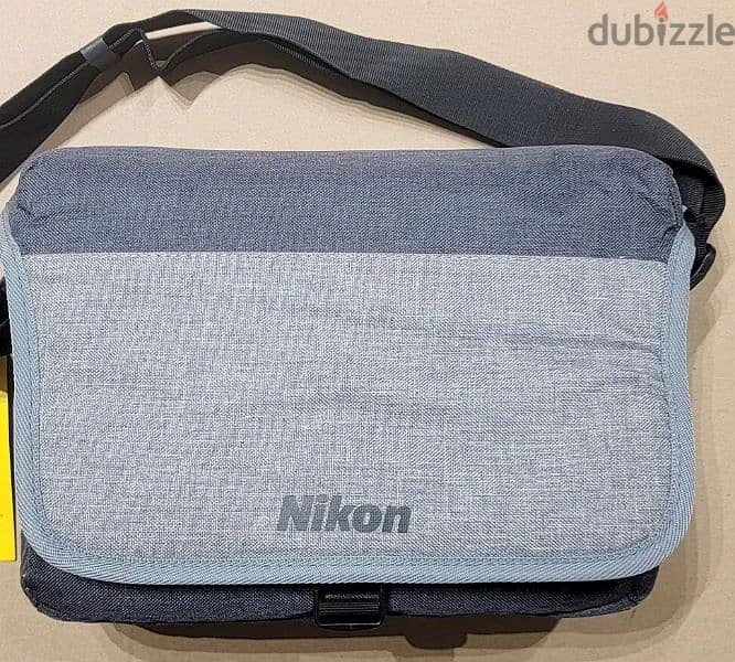 expat leaving - Nikon DSLR Camera Shoulder Bag 1