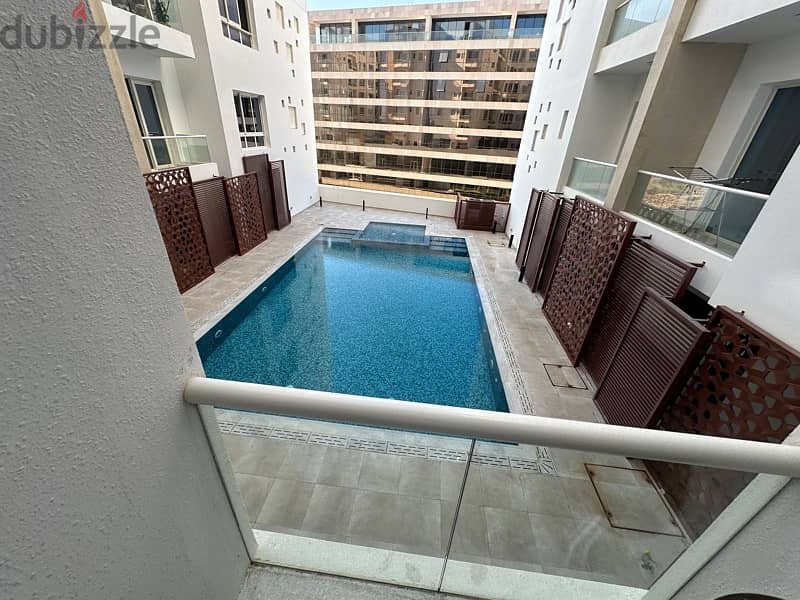 luxury furnished flat in muscat hills with swimming pool view 0