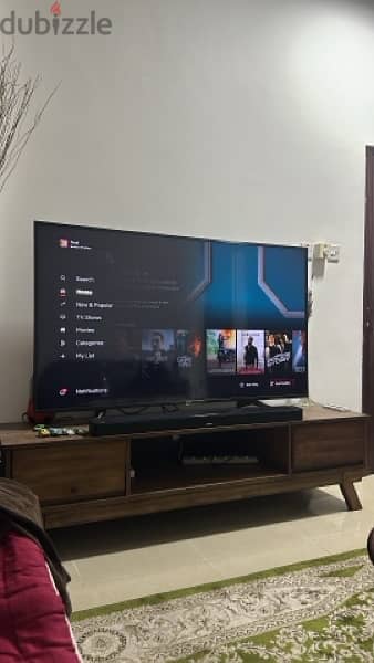sony bravia 65 inch 4k ultra hdr android tv with sturdy wooden table 1