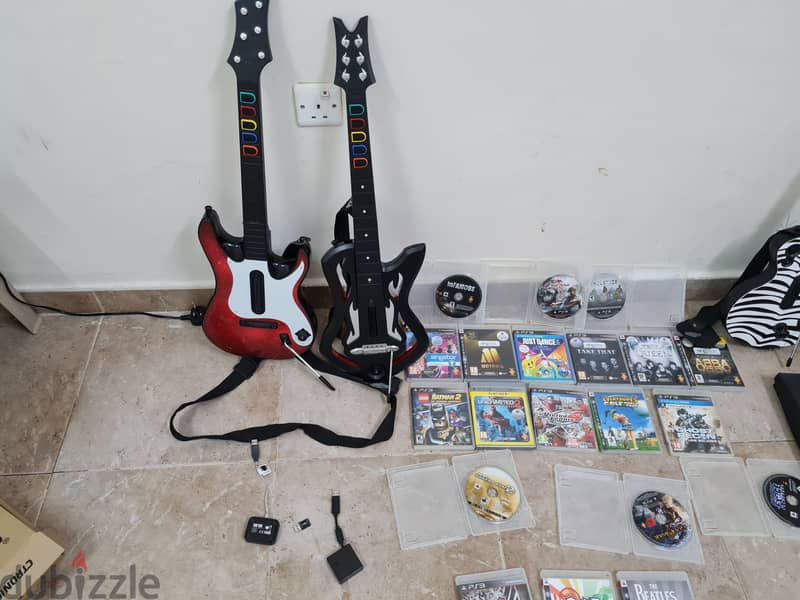 Ps3 with 20 games and guitar hero controllers 4