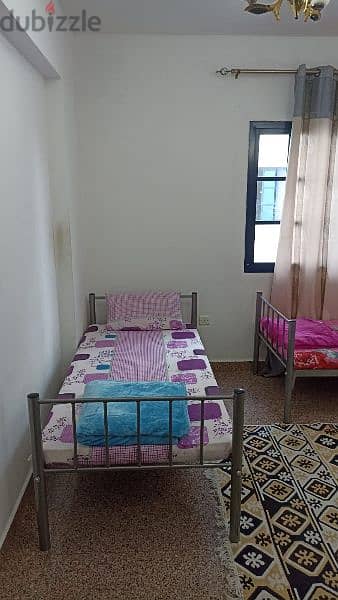 A bed in a shared room suitable for young people 6