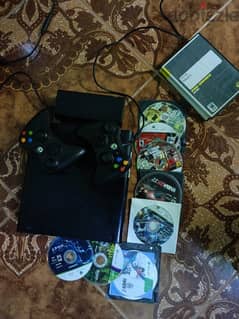 Xbox 360E 500 gb type with 2 controllers and 8 CDs GTA v