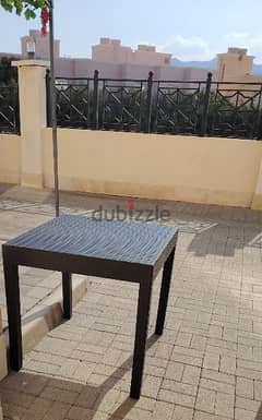 a black plastic table for sale