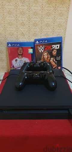 PS4 1 tb with two controllers and two cd's which are WWE and fifa 20