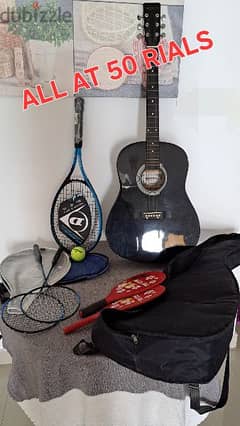 lot of tennis racket, guitar and beach games 0