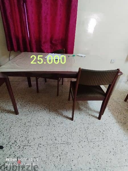 good condition dining table and one chair 0