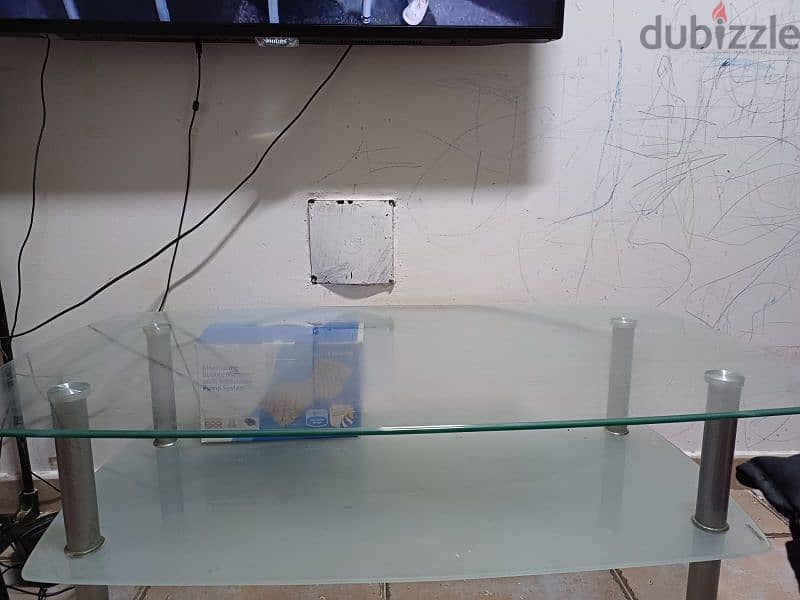 heavy glass centre table. . expat leaving urgent selling 1