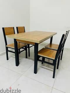 Dining table with 4 chairs. . . . . . . . good quality and good condition