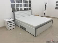 King size bed with mattress and one night stand