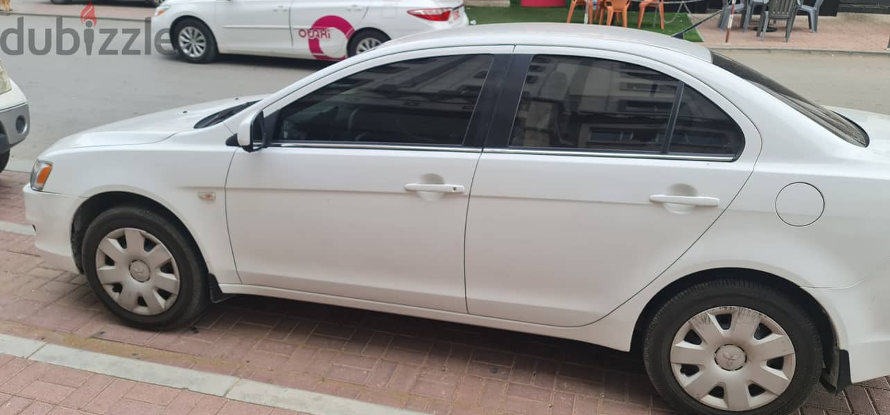 Lancer 2010 model ,very good condition, neat and clean 5