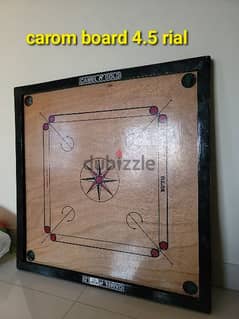 Carom board with strikers