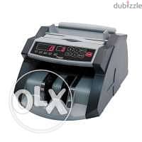 Currency counting machine. /آلة عد العملات.