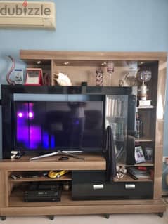 TV with TV cabinet and dinning table with 3 chairs