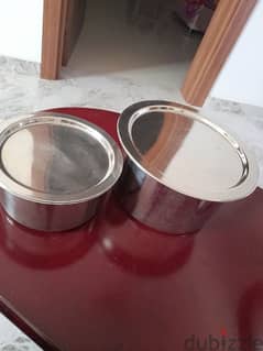 Two cooking pots with lids