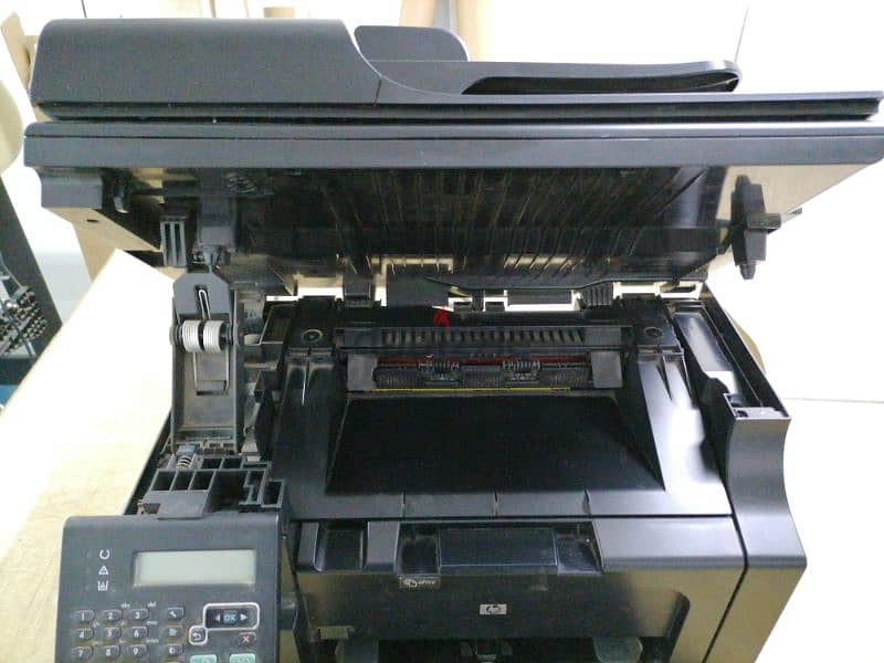 HP LaserJet Pro M1212nf Multifunction Printer 1