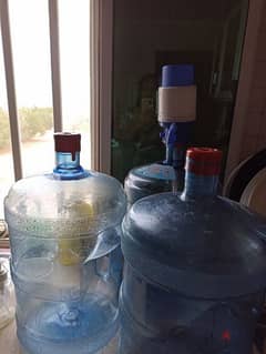 3 water cans with pump