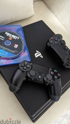 ps4 pro with 3 games+ 2 hand controls