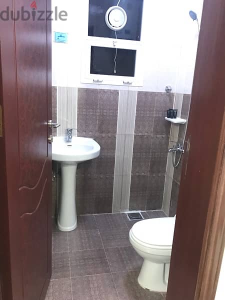 Tiny room with attached toilet for rent- only 1 lady 12