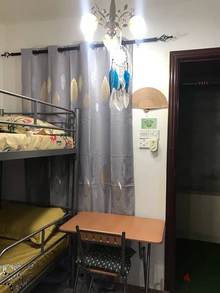 Tiny room with attached toilet for rent- only 1 lady 13