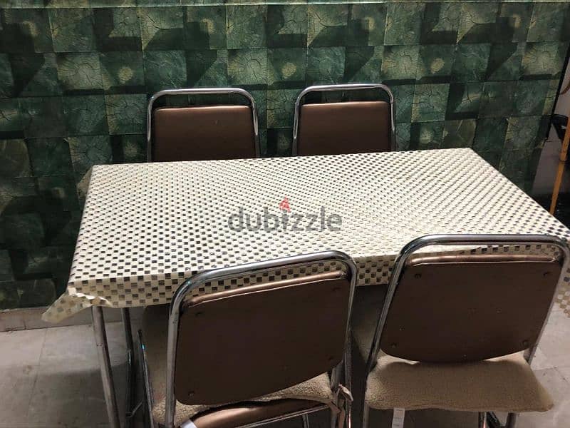 Glass dining table with four chairs 1