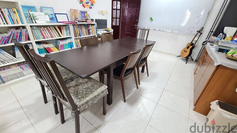 Good dining table and 7 chairs, 90 omr 1