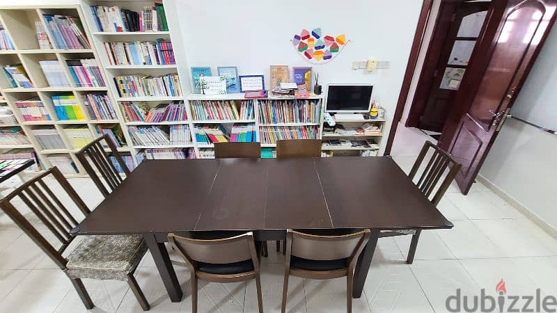 Good dining table and 7 chairs, 90 omr 2