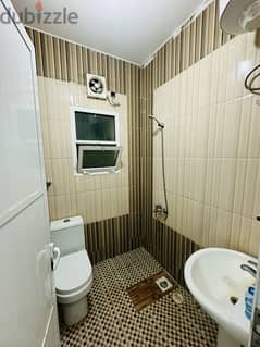 A room and a bathroom with citals behind City Center, including