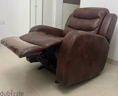 two single recliners , brown leather , barely used, RO. 120 each