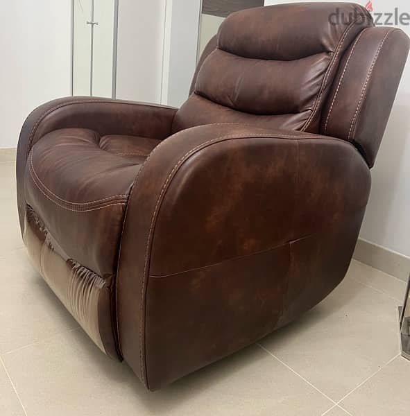 two single recliners , brown leather , barely used, RO. 120 each 1