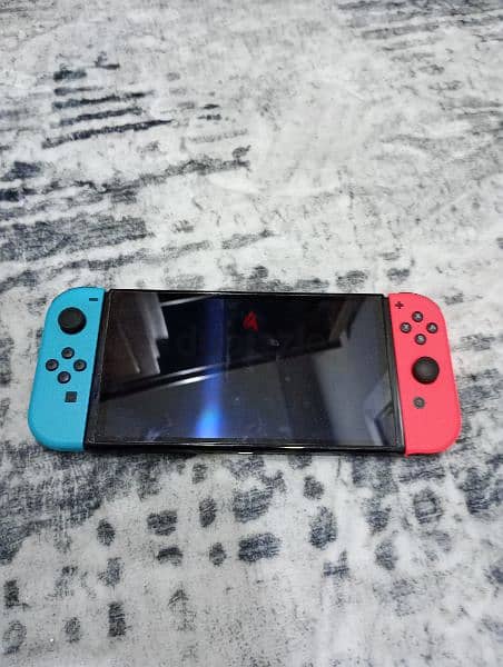 Nintendo switch OLED with controller, case and 5 games 4