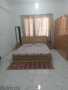 King size bed, two side table and six door Almirah