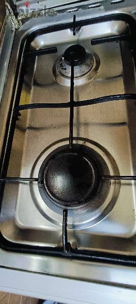 Cooking range. . . Oven maintenance required. . Slightly damaged. . . 2