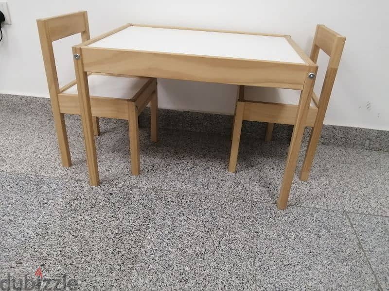 Kids table with two chairs. . 1