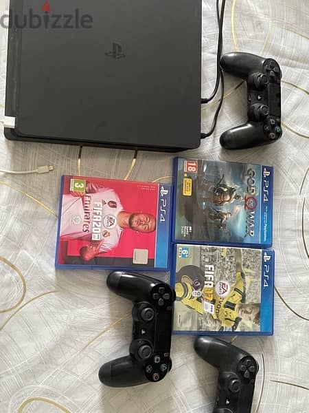 PS4 slim with 3 controllers and 3 game CD 1