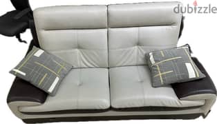3 leather coaches with pillows