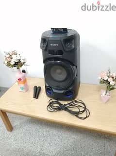 Sony Home Sound System with table, two mics, cable and flowers to sell