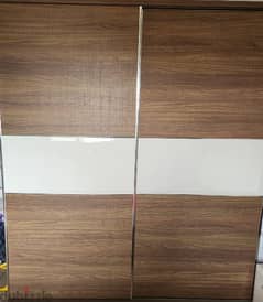 white and brown home centre sliding door cupboard