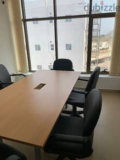 Meeting table with 7 chairs and 2 sofas available