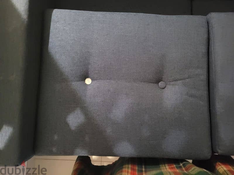 Sofa with some scratches and one button missing. 3